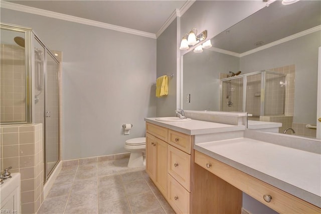 bathroom featuring tile patterned floors, crown molding, an enclosed shower, toilet, and vanity