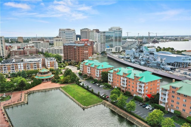 birds eye view of property with a water view