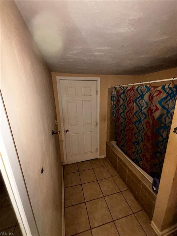 bathroom with tile patterned flooring