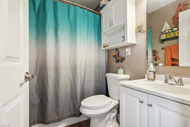 bathroom featuring a shower with curtain, vanity, toilet, and hardwood / wood-style floors