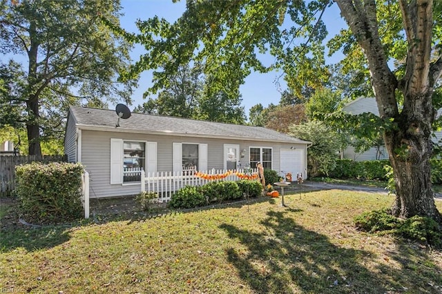 view of front facade with a front lawn and a garage