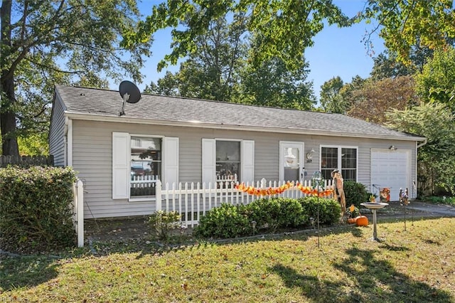 view of front of house with a garage and a front yard