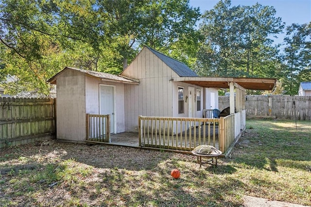 view of outbuilding with a yard