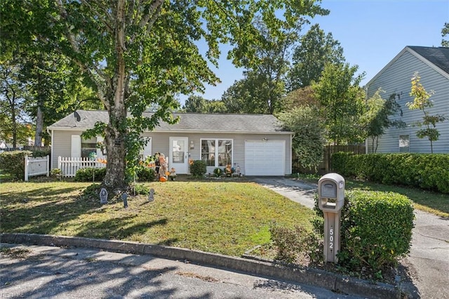 single story home with a front yard and a garage