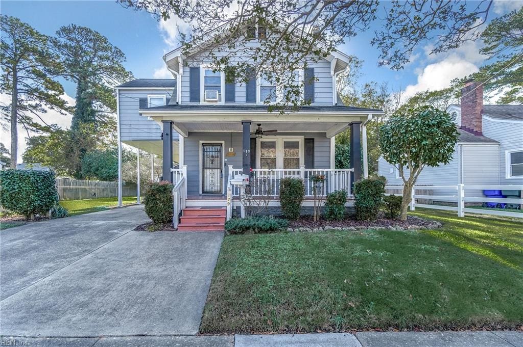 view of front of house featuring a front lawn and covered porch