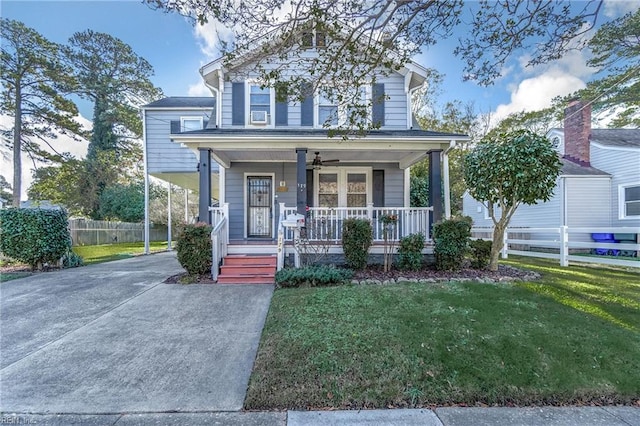 view of front of house featuring a front lawn and covered porch