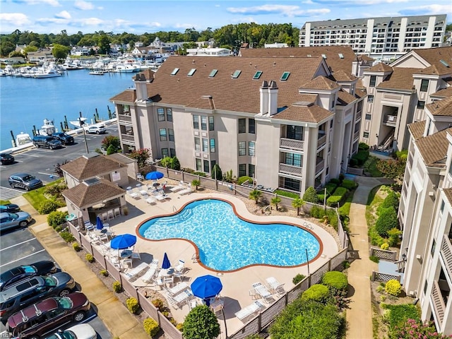 view of pool with a water view