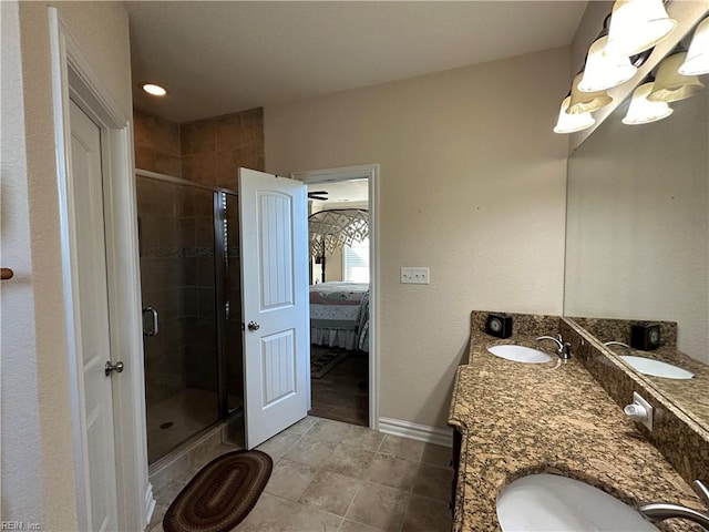 bathroom with tile patterned floors, vanity, and an enclosed shower