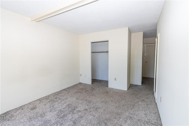 unfurnished bedroom featuring light carpet