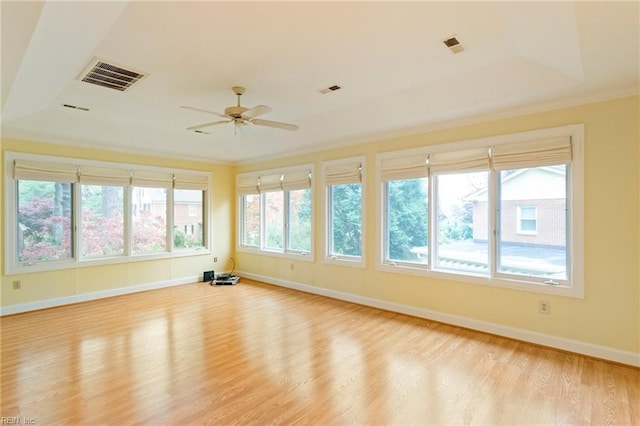 interior space with ceiling fan, light hardwood / wood-style floors, and ornamental molding