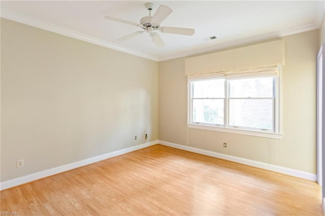 unfurnished room featuring ceiling fan, light hardwood / wood-style floors, and ornamental molding