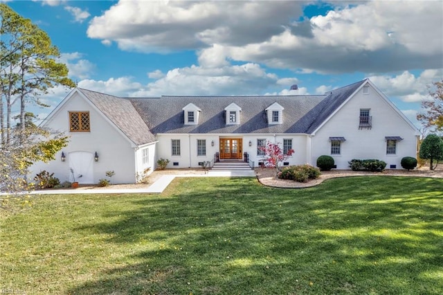 cape cod house with a front lawn