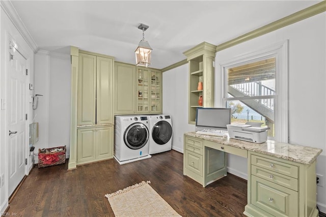 laundry area featuring dark hardwood / wood-style flooring, crown molding, and washing machine and dryer