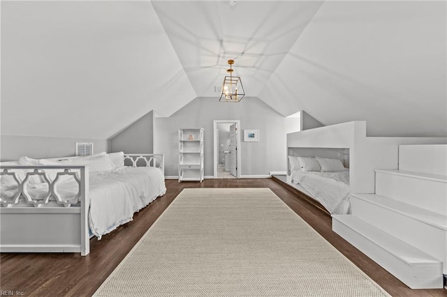 bedroom with dark hardwood / wood-style floors, vaulted ceiling, and a notable chandelier