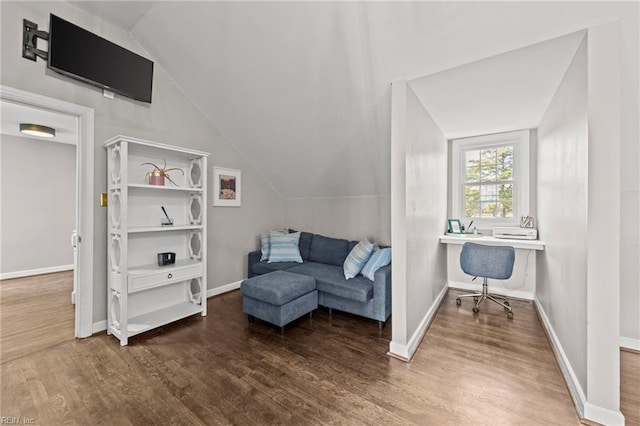 living area with hardwood / wood-style floors and lofted ceiling