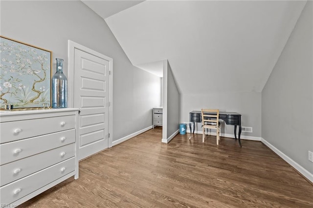 bonus room with hardwood / wood-style floors and lofted ceiling