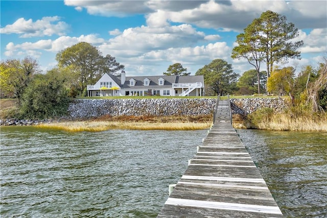 dock area with a water view