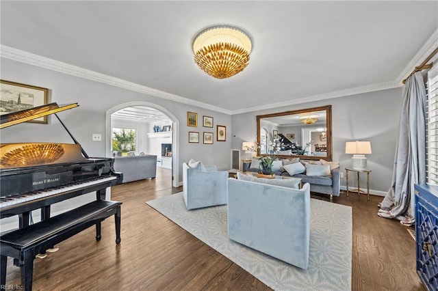 living room with crown molding and hardwood / wood-style floors