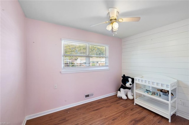 bedroom featuring dark hardwood / wood-style floors and ceiling fan