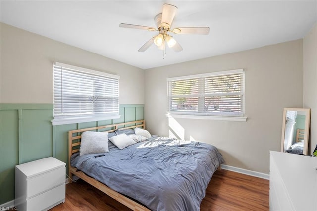 bedroom featuring wood-type flooring and ceiling fan