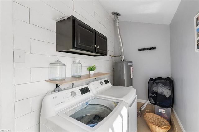 laundry room with cabinets, independent washer and dryer, and gas water heater