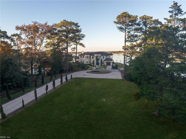 yard at dusk with a water view