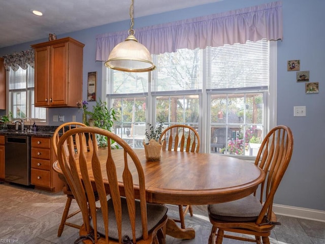 dining room with plenty of natural light and sink