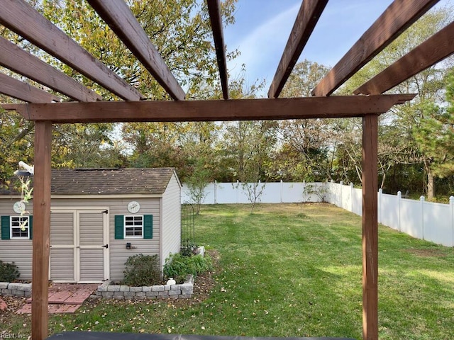 view of yard with a pergola and a shed