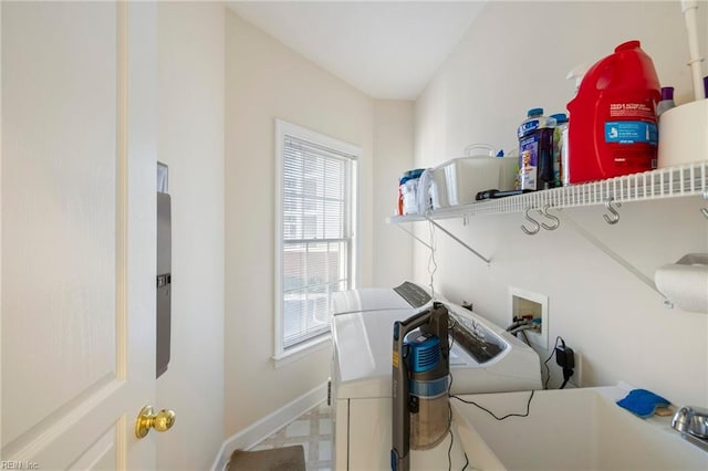 clothes washing area featuring independent washer and dryer