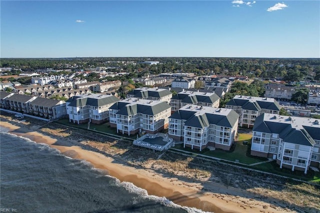 bird's eye view featuring a water view and a view of the beach