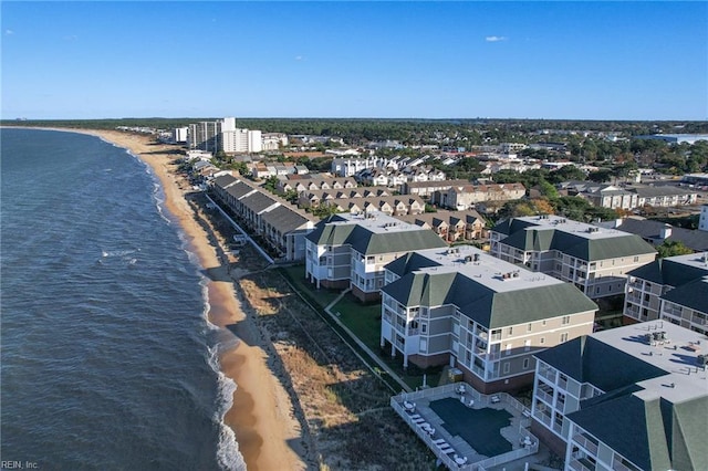 aerial view with a water view and a beach view