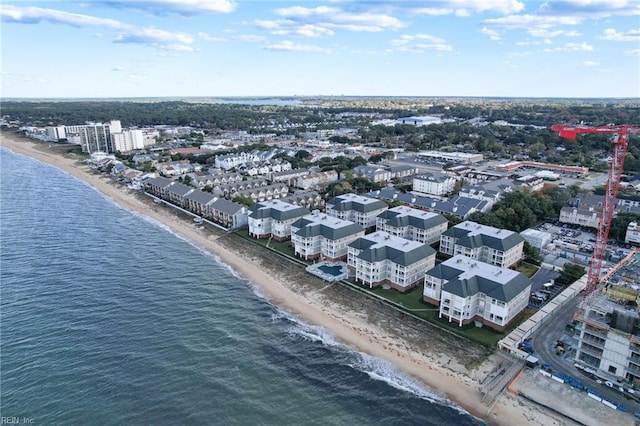 bird's eye view with a water view and a beach view