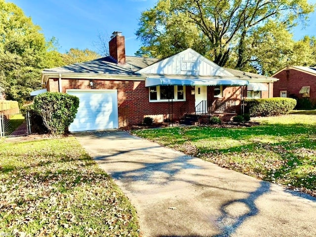 view of front facade with a garage and a front yard