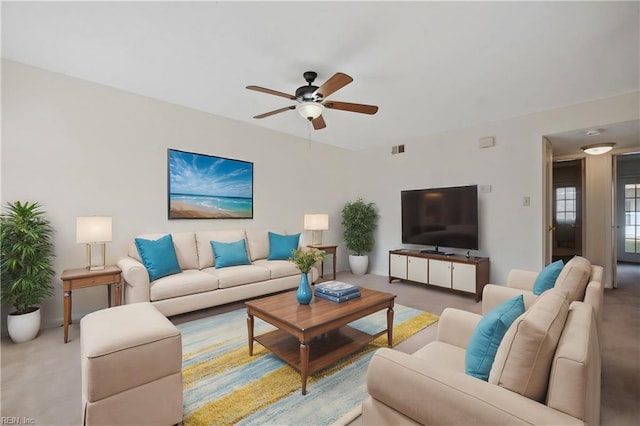 living room featuring ceiling fan