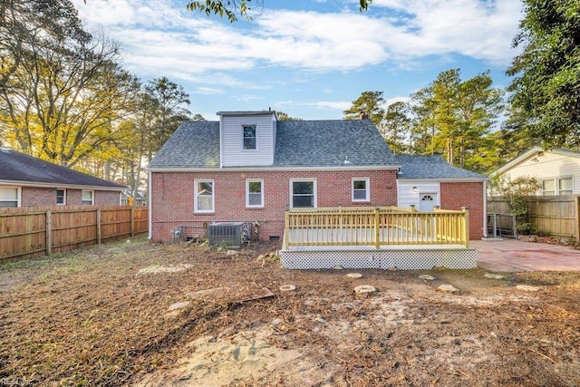 back of house featuring cooling unit, a patio area, and a deck