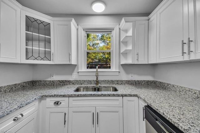 kitchen with white cabinetry and sink