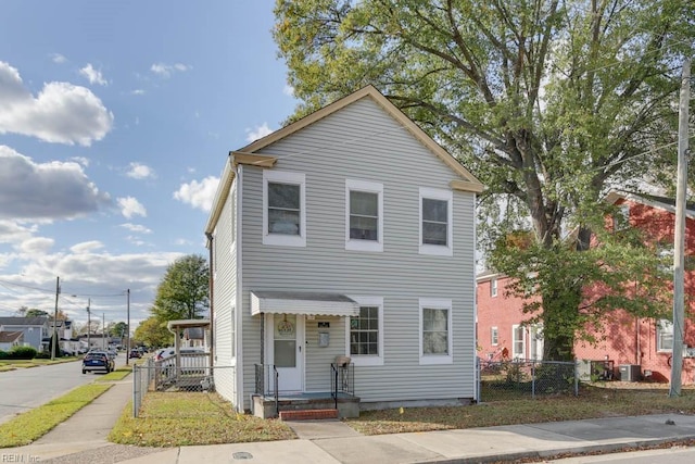 view of front of home featuring cooling unit