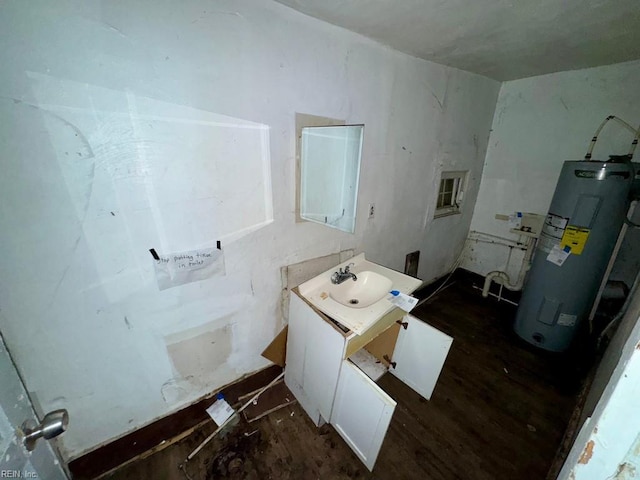 bathroom featuring hardwood / wood-style flooring, vanity, and water heater