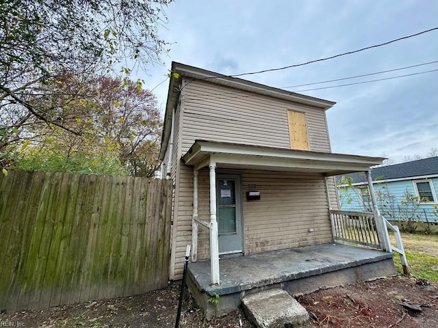 back of house with a porch