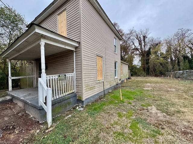 view of home's exterior featuring covered porch