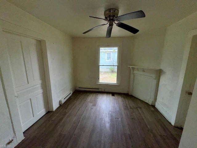 spare room featuring ceiling fan, a baseboard radiator, and dark hardwood / wood-style floors