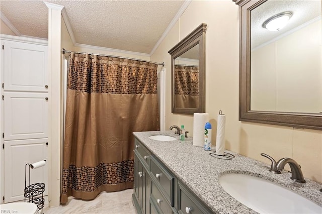 bathroom with a textured ceiling and crown molding