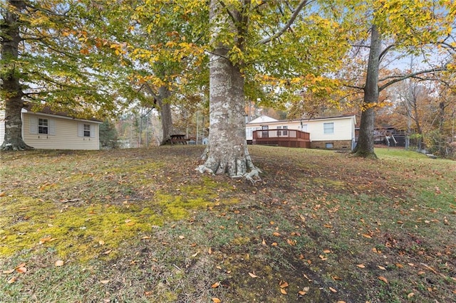 view of yard featuring a wooden deck