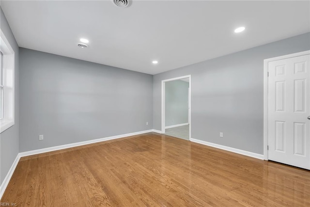 spare room featuring light wood-type flooring