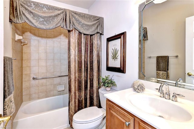 full bathroom with vanity, toilet, and shower / tub combo with curtain