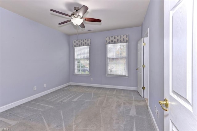 unfurnished room with light carpet and ceiling fan