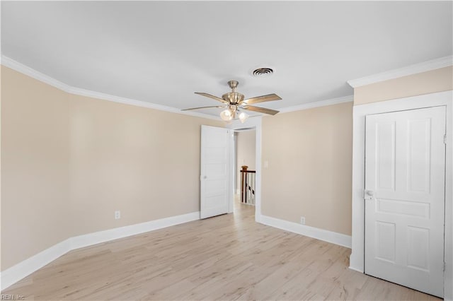 unfurnished bedroom with ceiling fan, light hardwood / wood-style floors, and crown molding