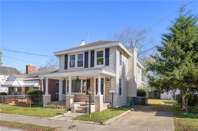 view of front of property with central AC and a porch