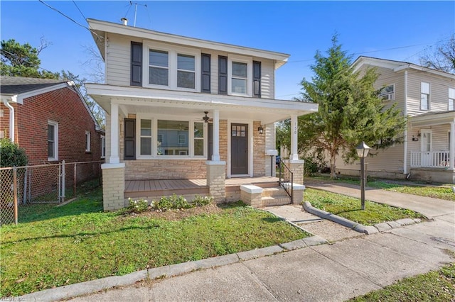 view of front of property with a porch and a front lawn