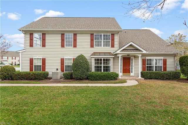 colonial inspired home with central AC and a front lawn